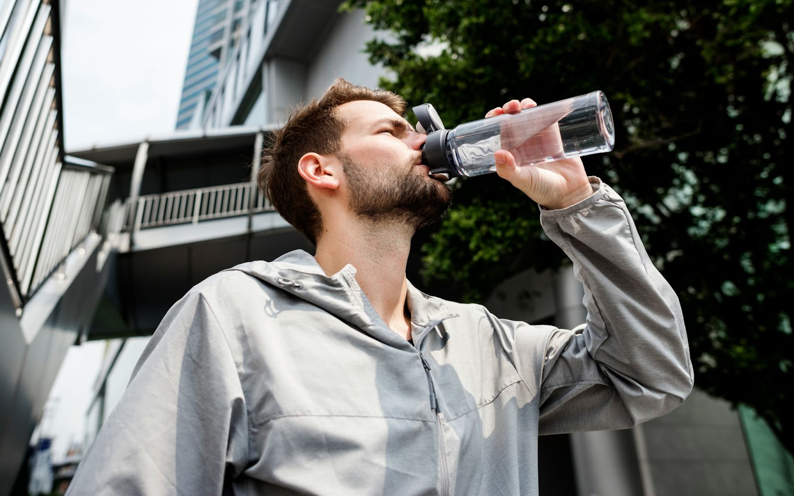 A man drinking a water.
