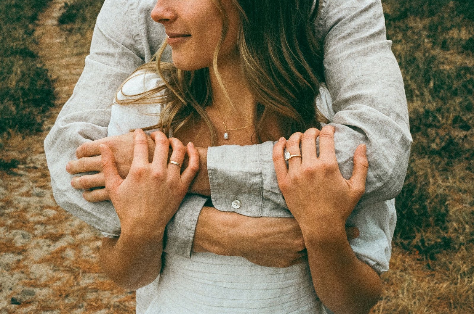 A man hugging a woman.
