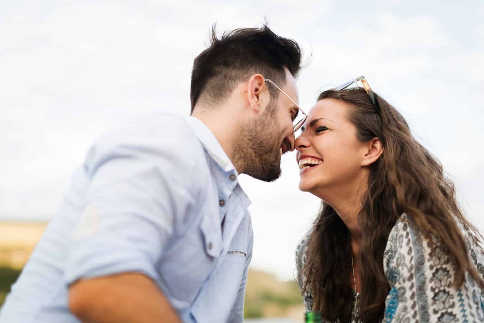 A man and woman facing each other.