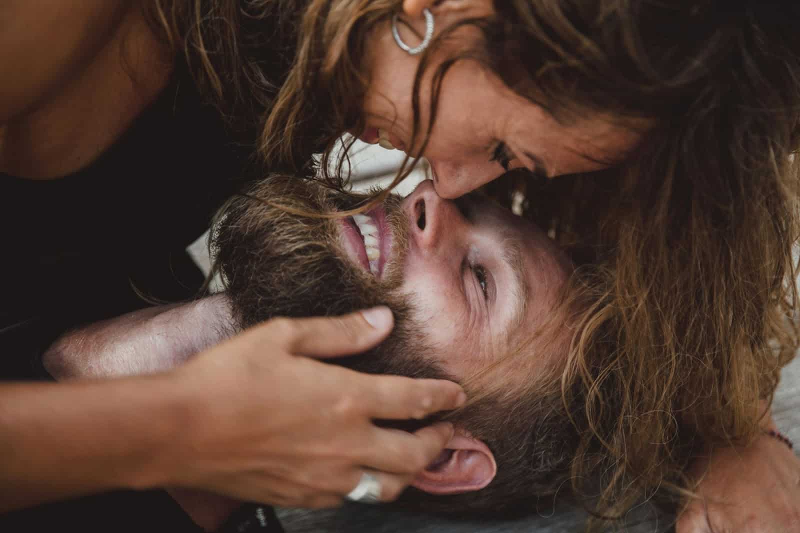 A man and woman laughing together.