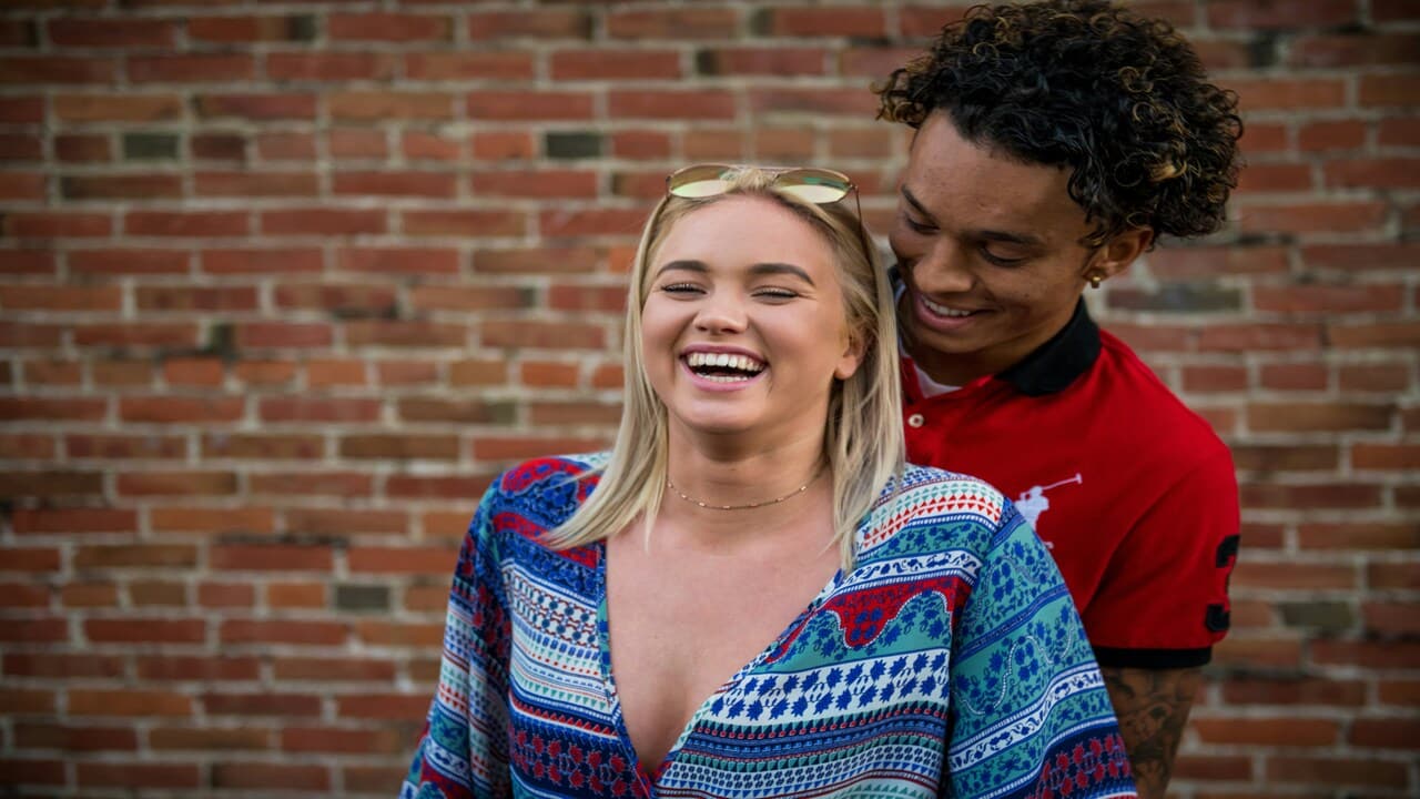 A man surprising a woman.
