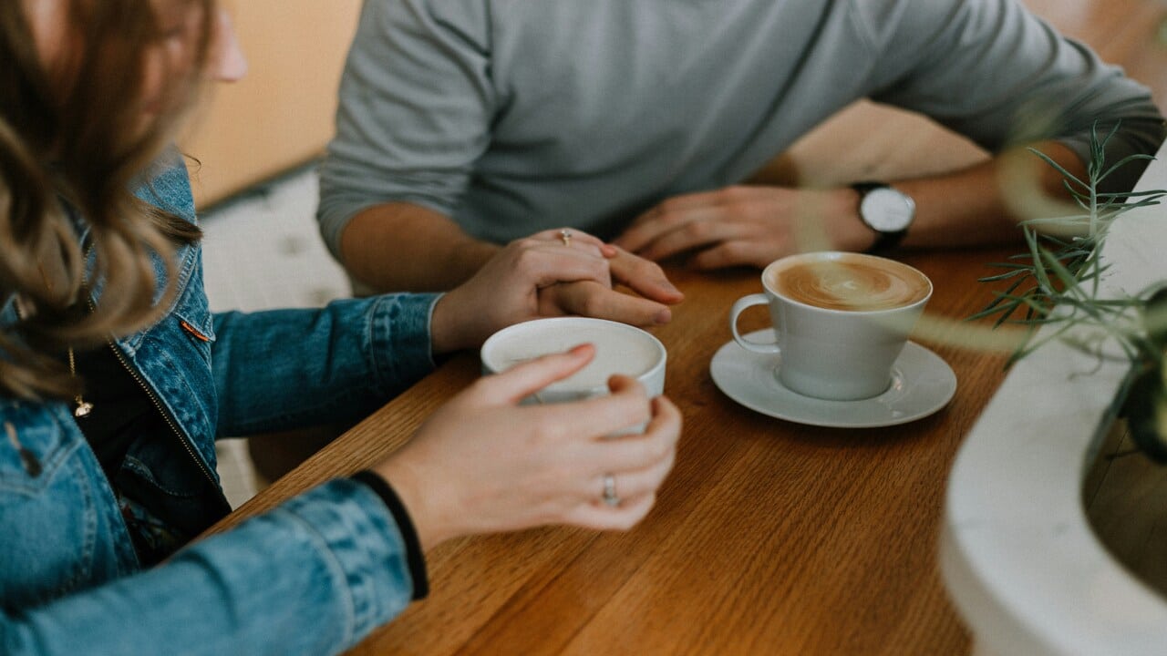 A couple having coffee during the day.