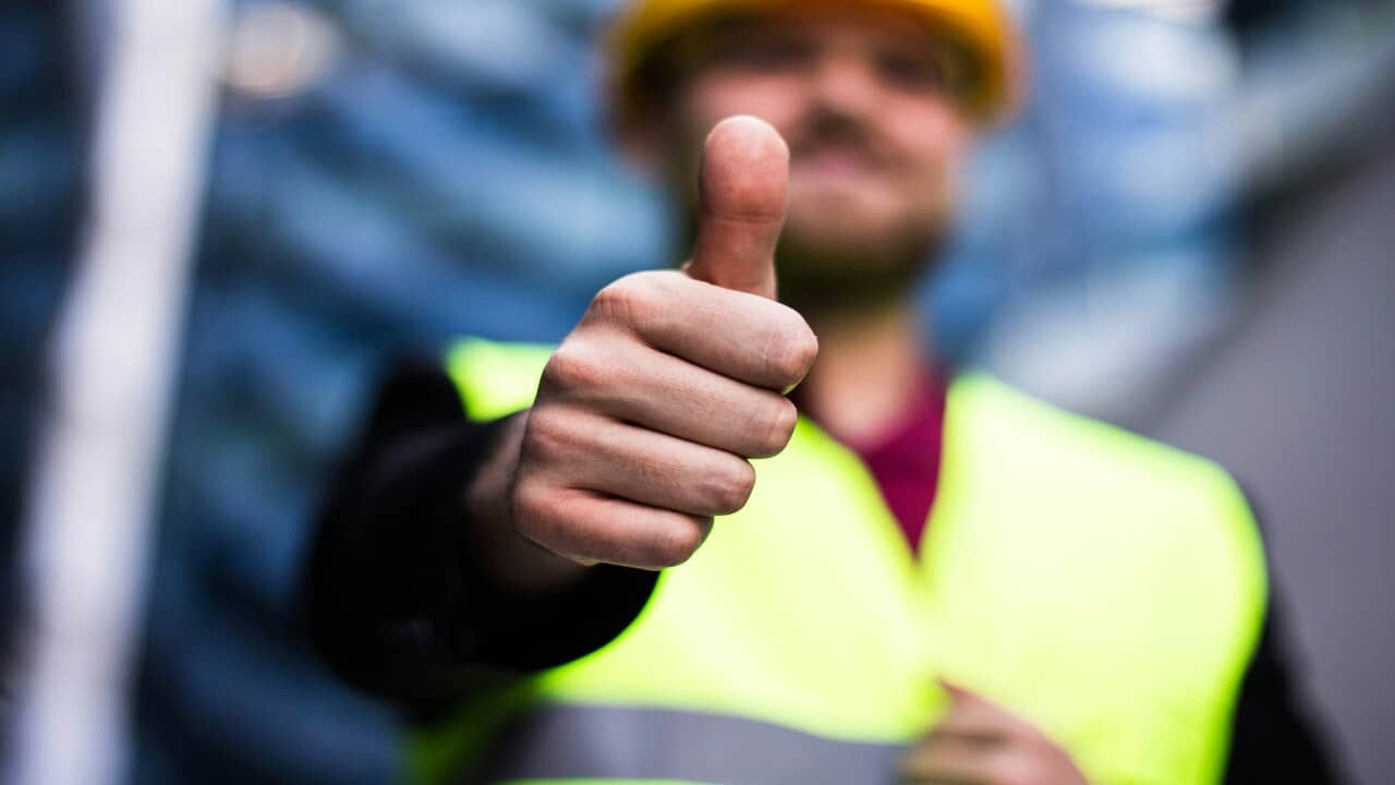 A man giving a thumbs up sign.
