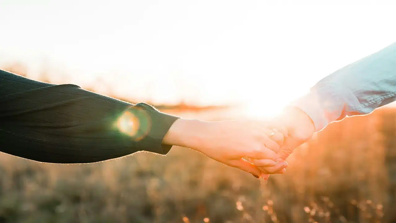 Two people holding hands.