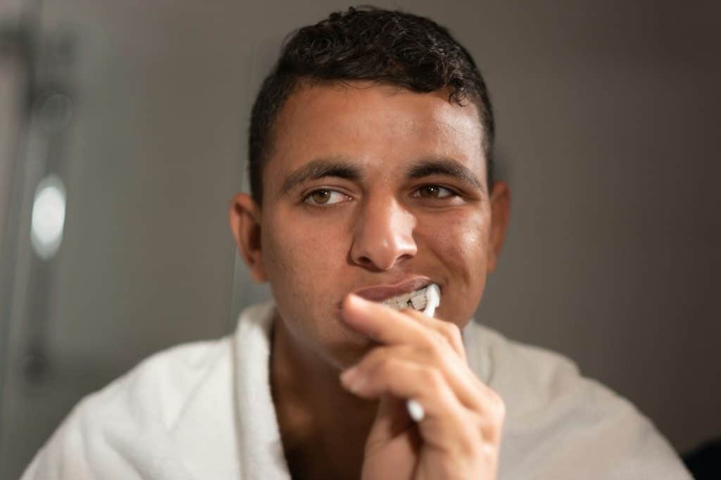 A man brushing teeth