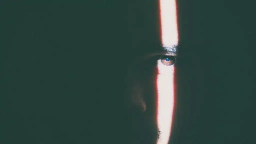 A man’s eye lit by the sunlight.