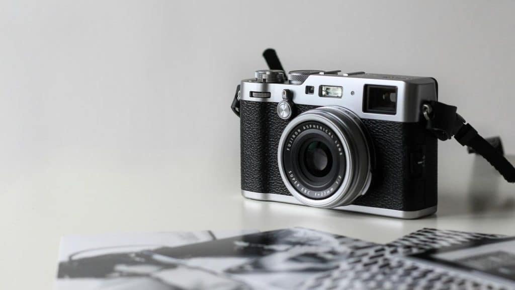 A vintage-style camera on a table.