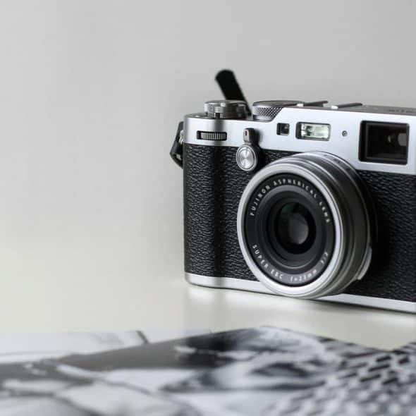 A vintage-style camera on a table.