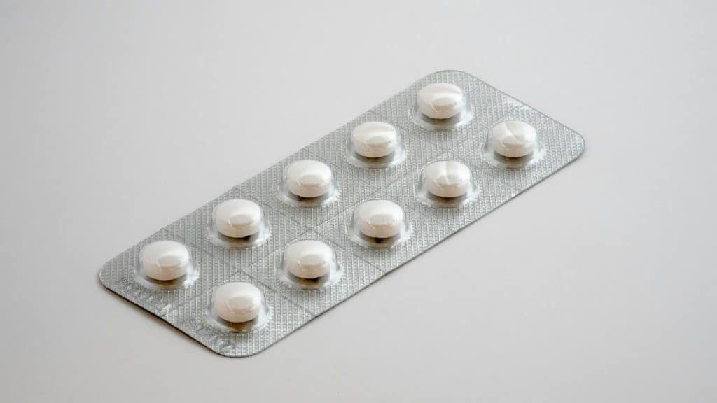 A blister pack containing ten white round penicillin tablets.