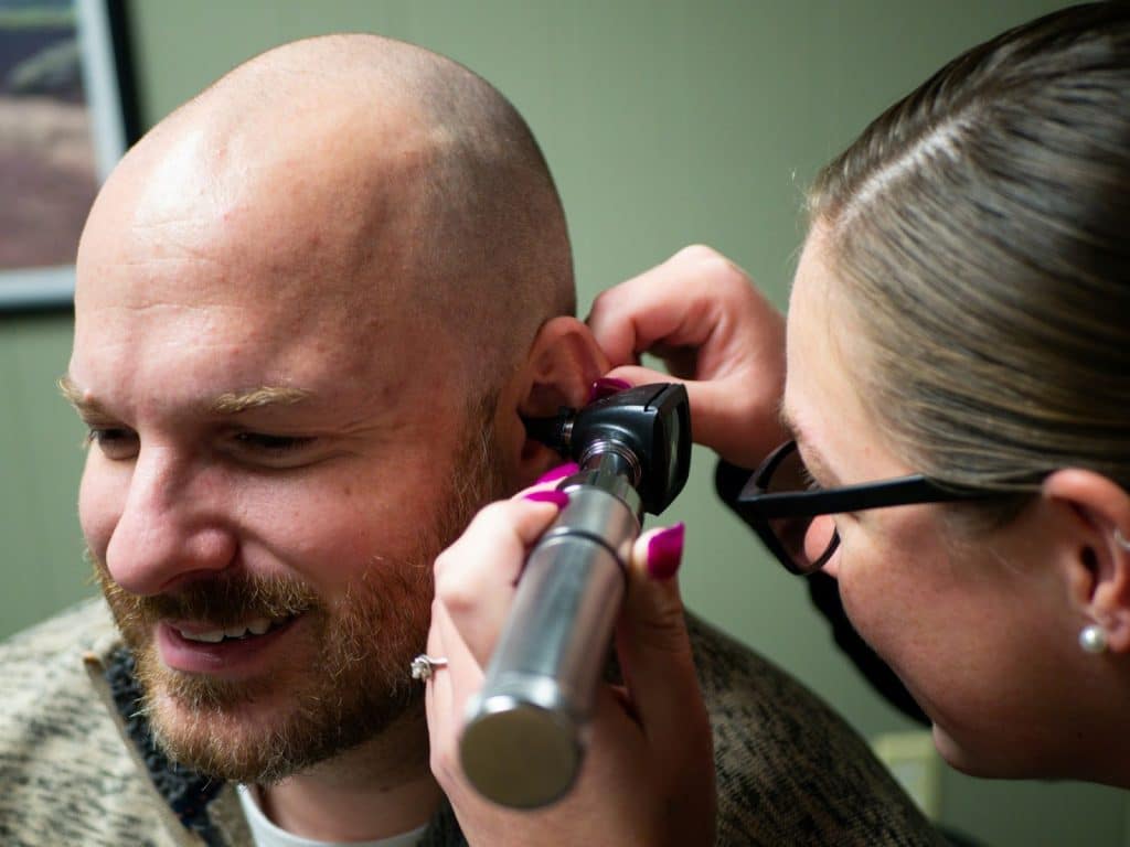 A man getting his ear check