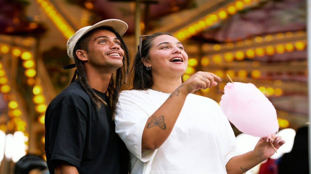 A couple at an amusement park