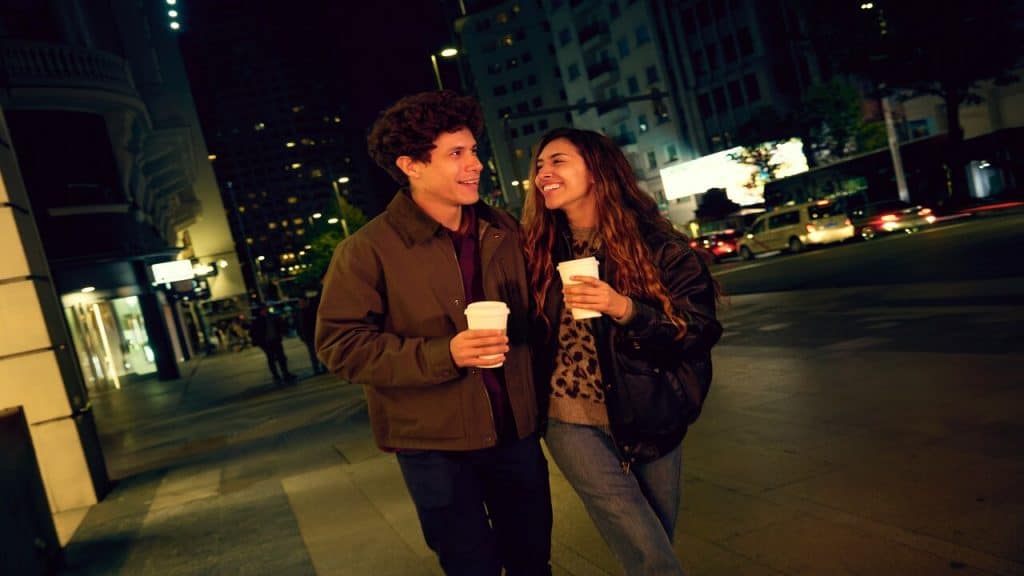 A couple drinking coffee at night
