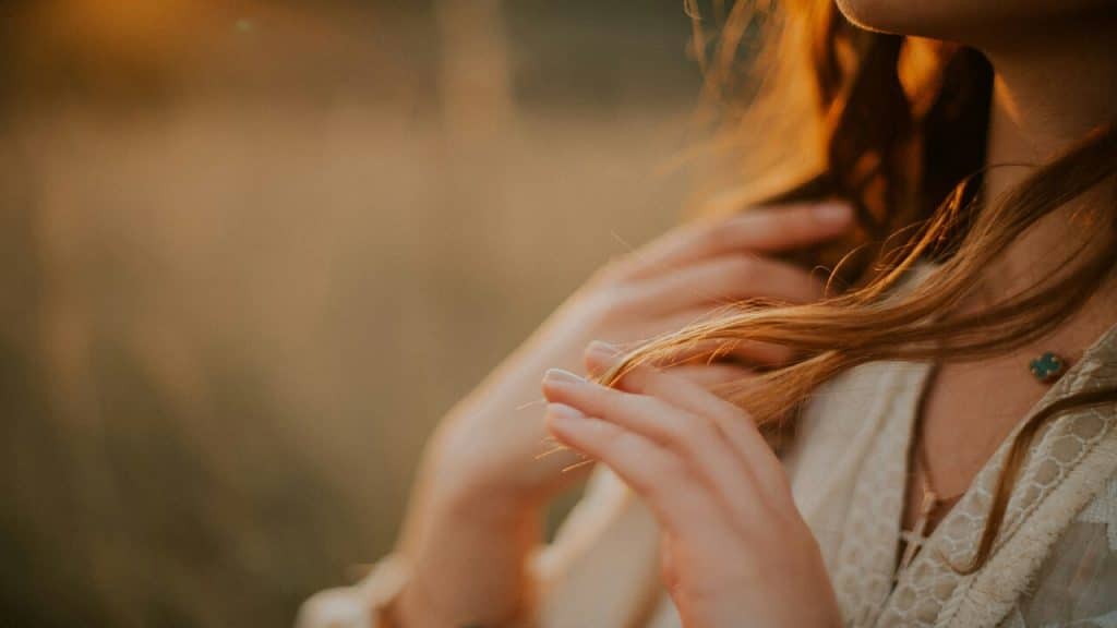 A woman playing with her hair
