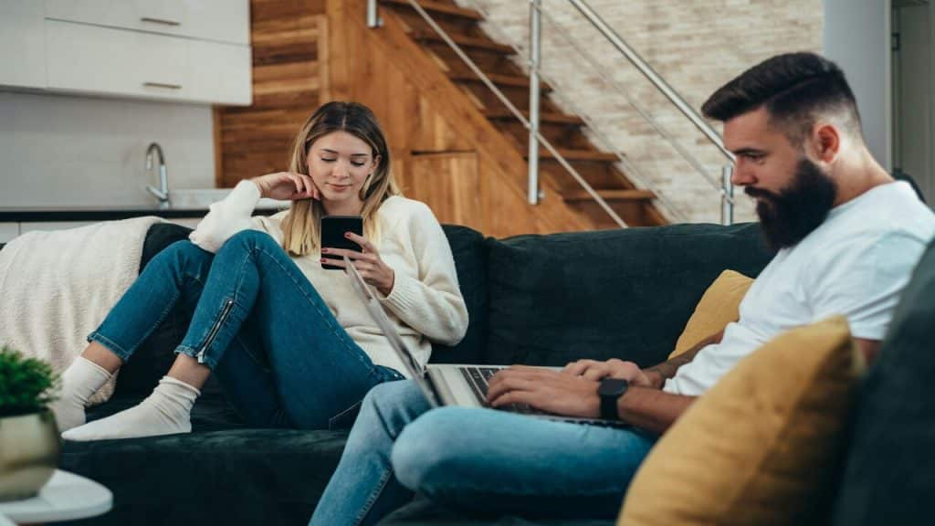 A couple busy with their devices