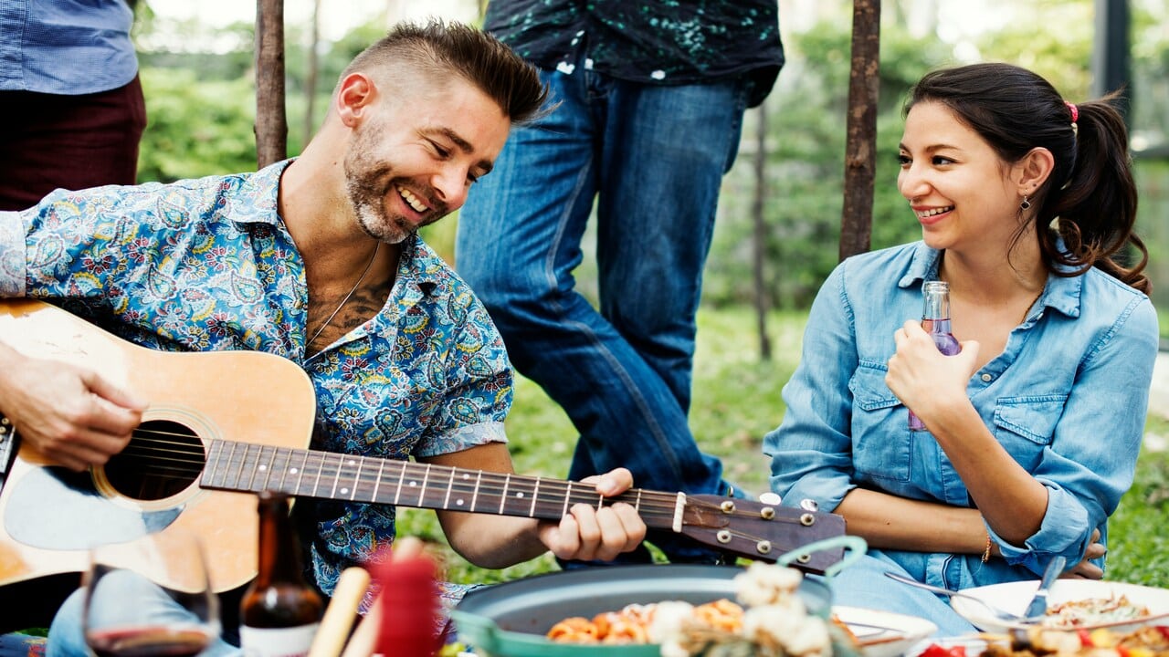 A man serenading a woman.