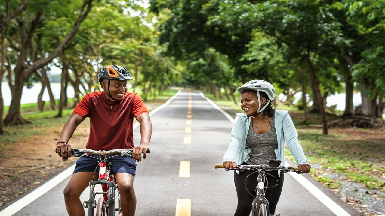 A couple biking together.