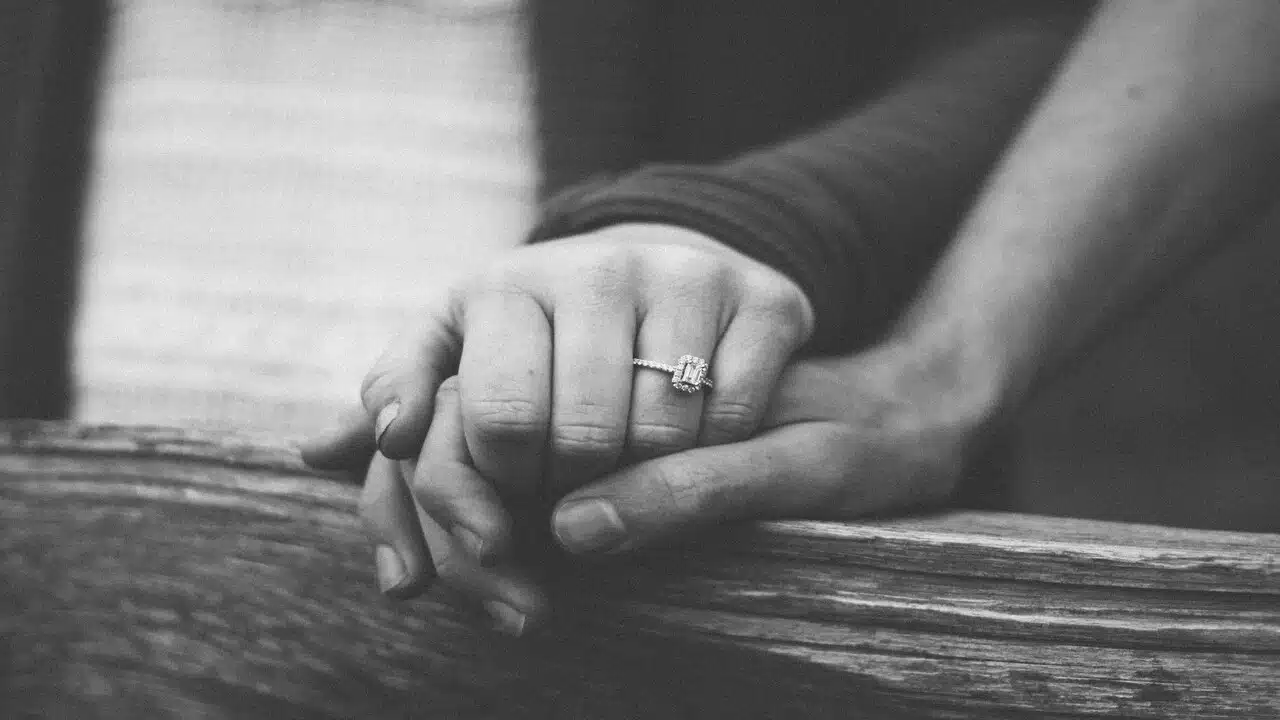 A couple holding hands.