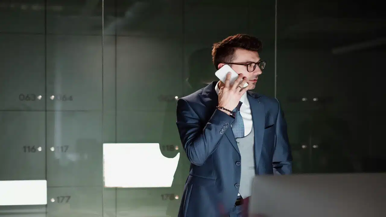 A man calling someone on the phone.