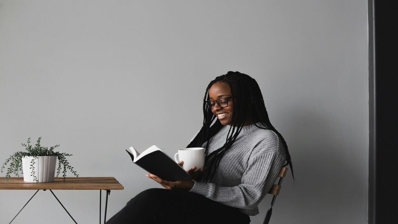 A woman reading by herself.