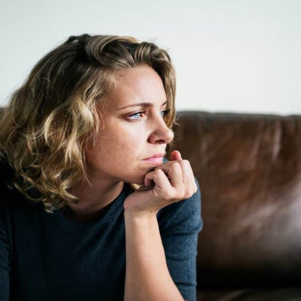 A woman looking disappointed by herself