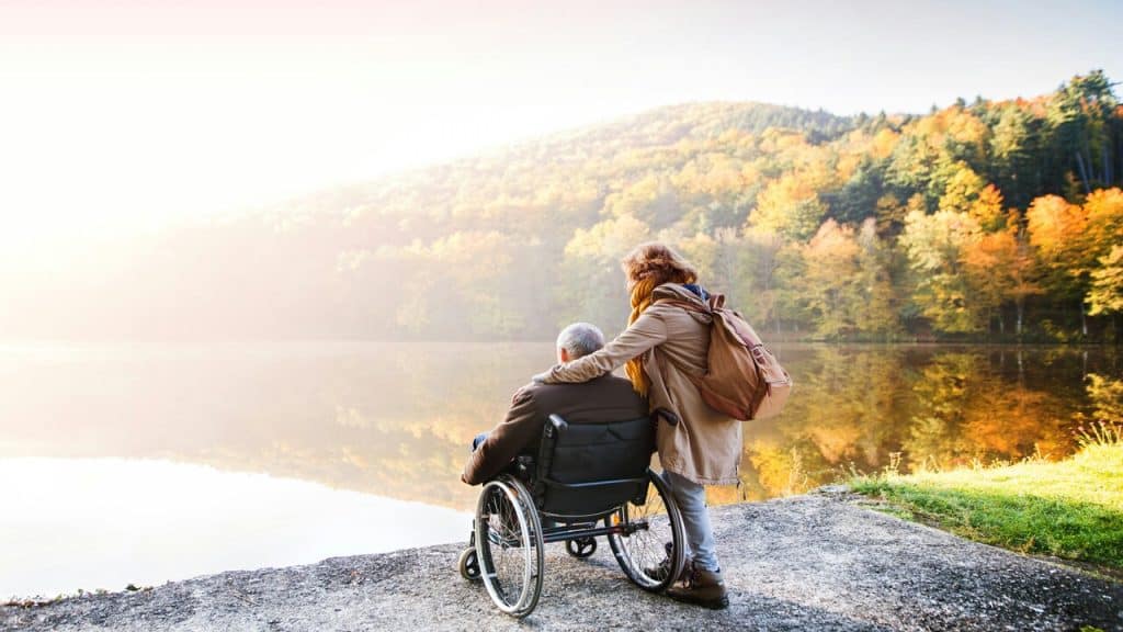 A woman caring for an elderly relative