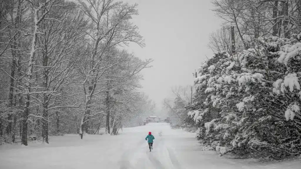 A person running during a snow storm