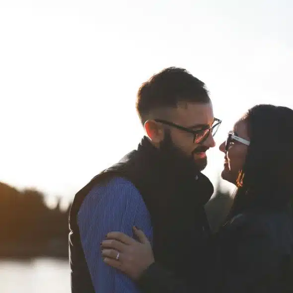A man and woman facing each other