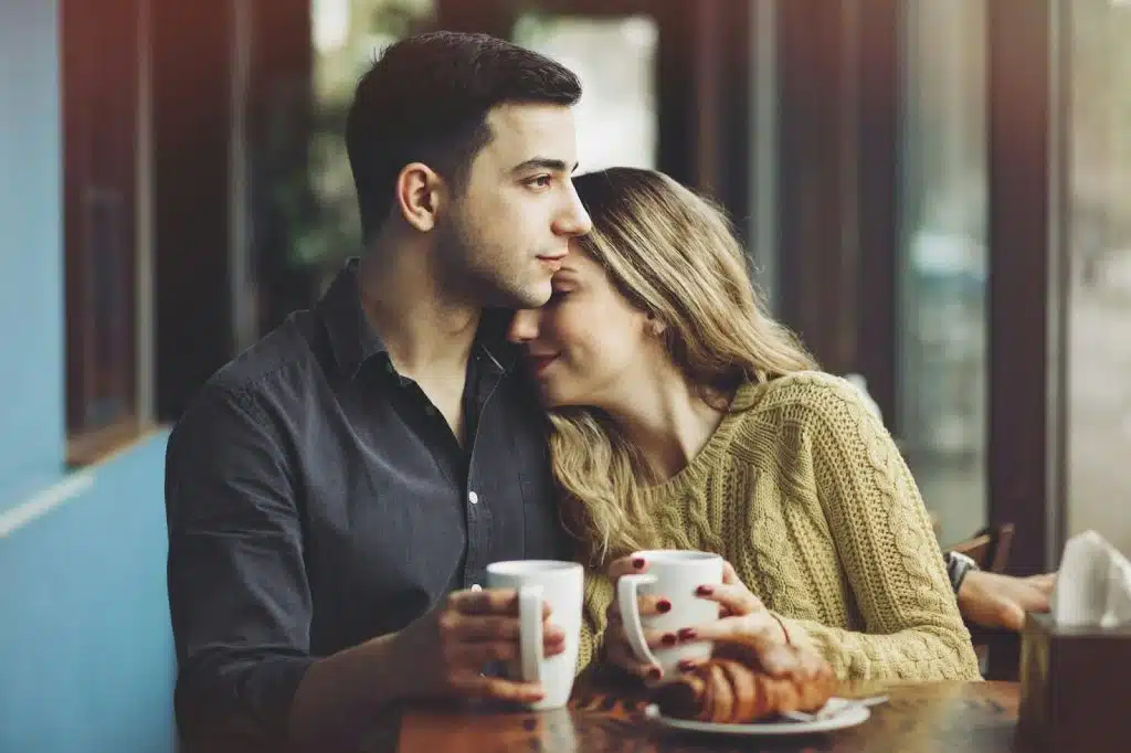 A man and woman being close together