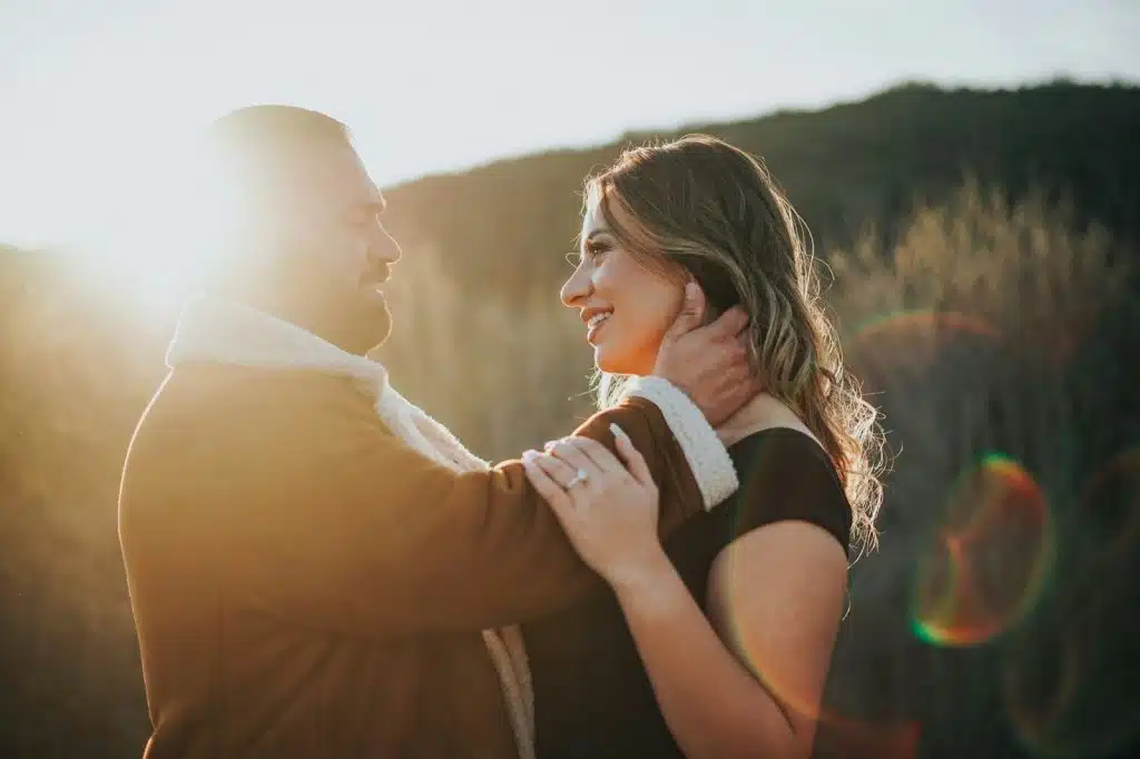 A man and woman facing each other