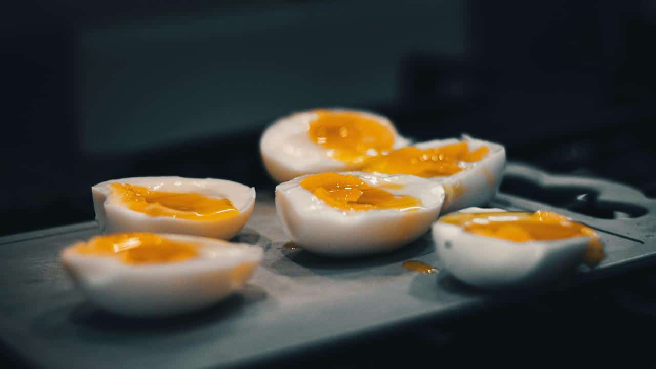 A tray of halved soft-boiled eggs.