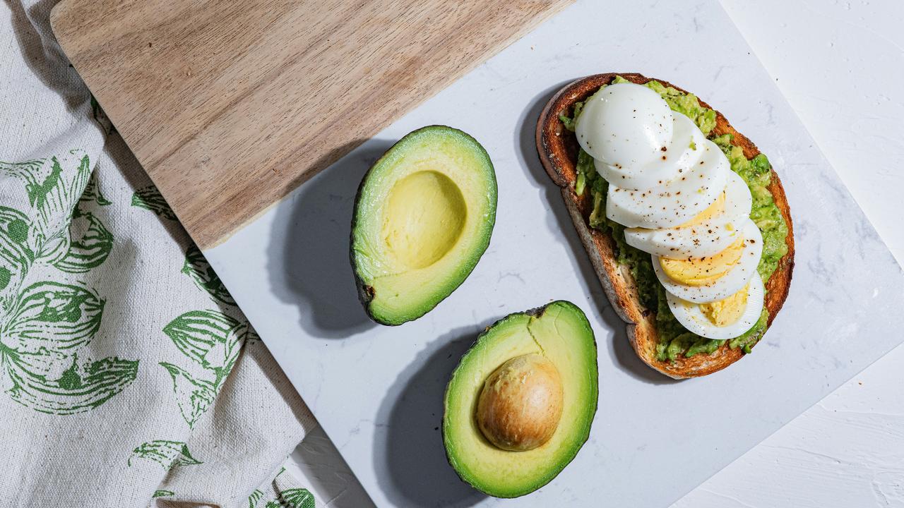An avocado toast with sliced egg.