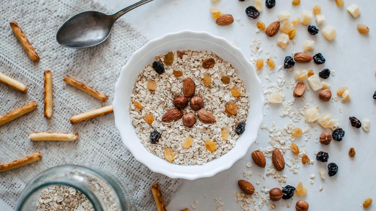 A bowl of oats with nuts.