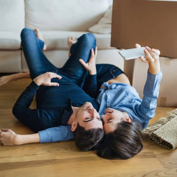 A man and woman laying on the floor