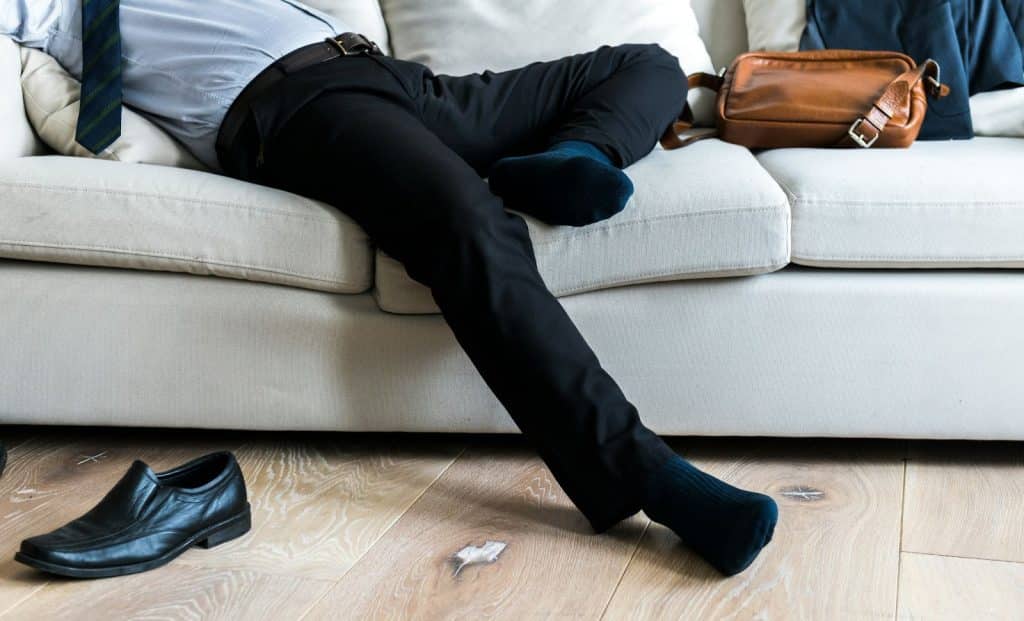 A man resting his legs and feet 
