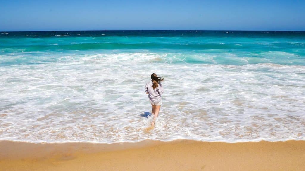 A woman standing on the shore