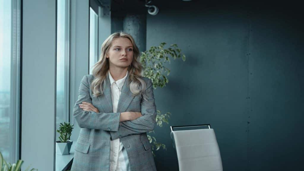 A nonchalant woman by the window