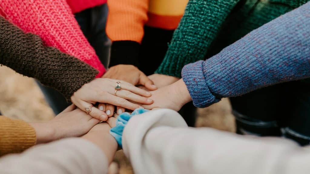 A group of people during a huddle.