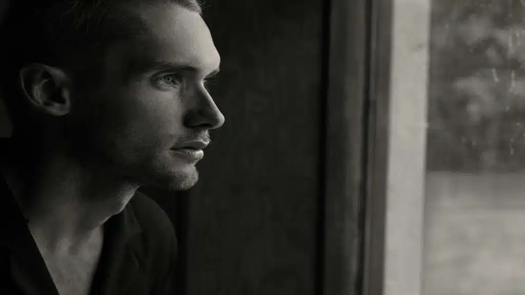 A man looking out the window.