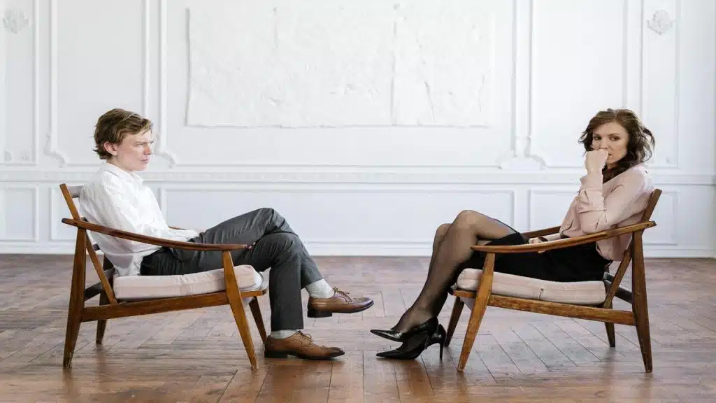 A couple ignoring each other.