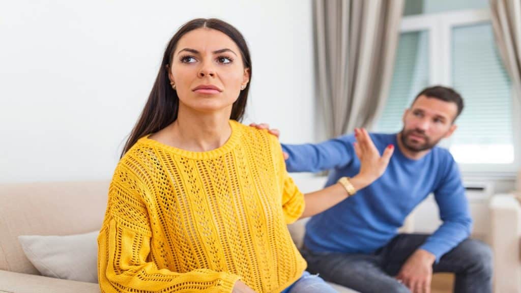A woman ignoring her partner at home.