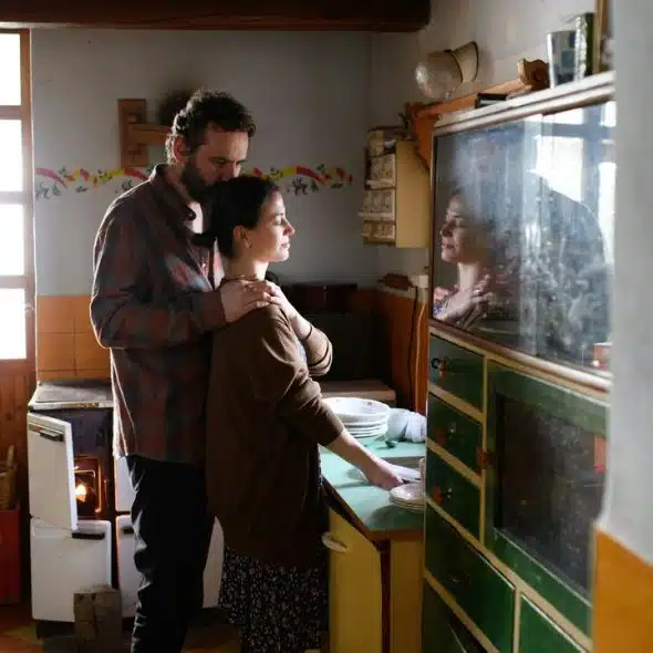 A couple looking sad in the kitchen