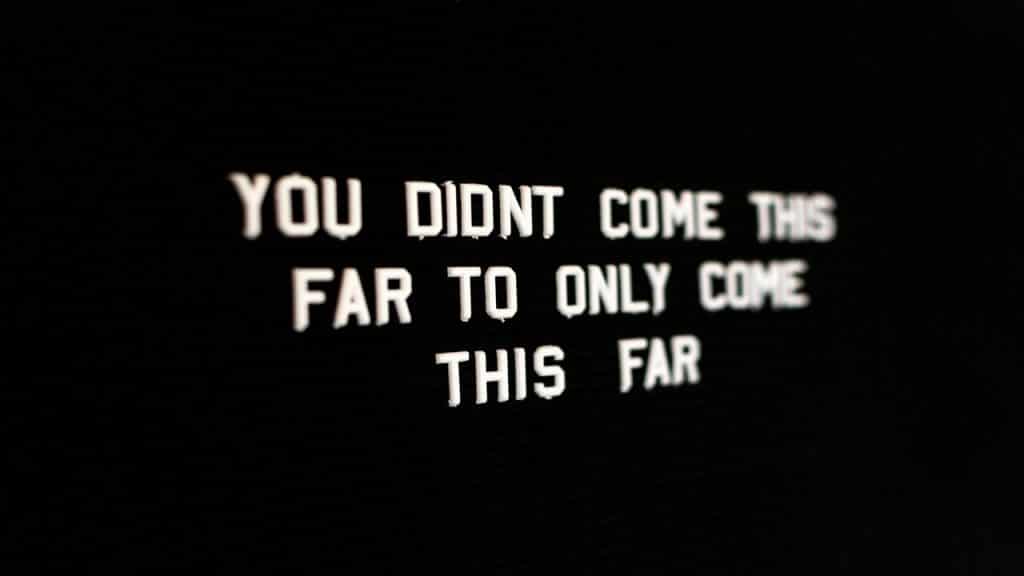 An inspirational quote on a black background