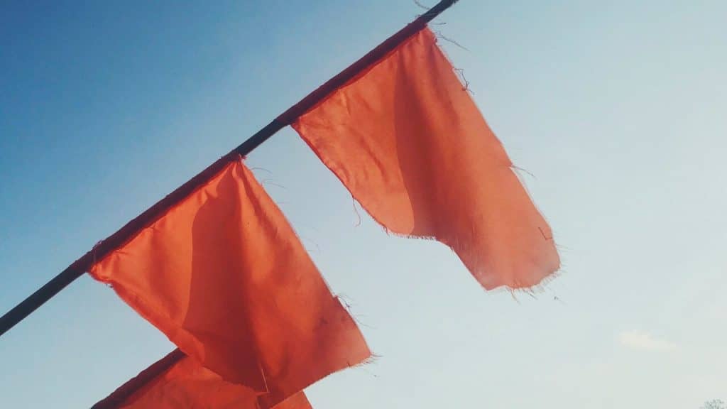 Red flags on a metal pole