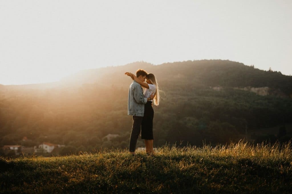 A man and woman hugging each other