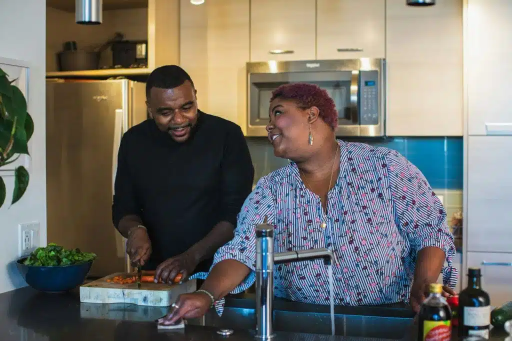 A man and woman cooking together