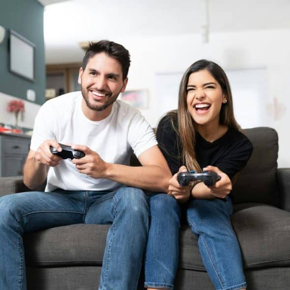 A man and woman playing video games