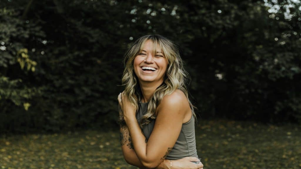 A happy woman in a garden