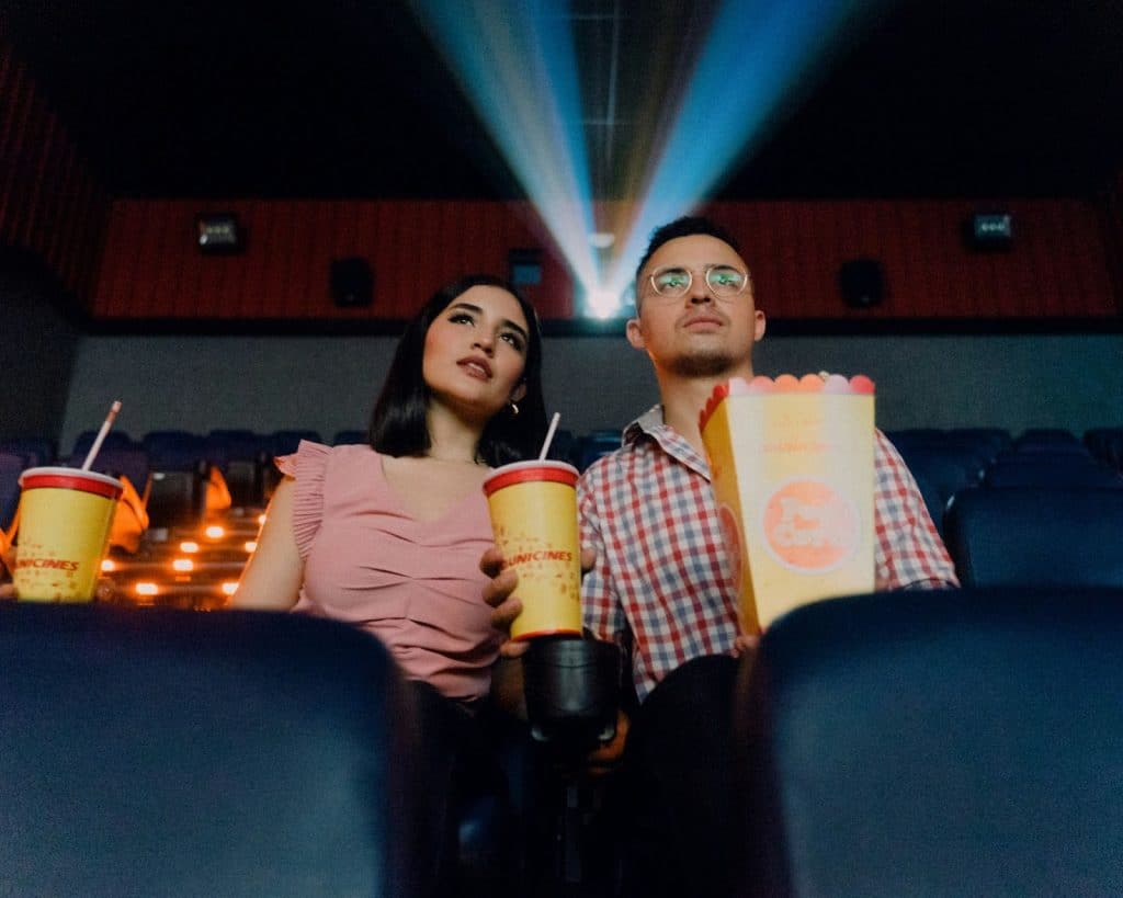 A man and woman watching at the cinema 