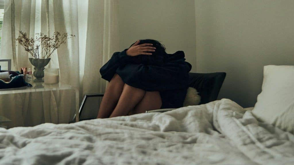 A woman with her head in her hands