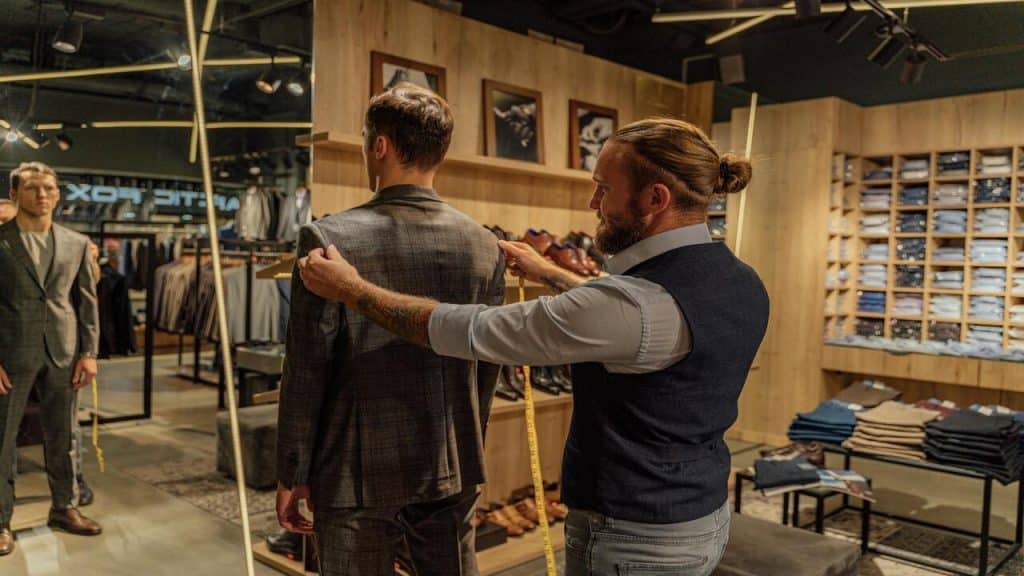 A man being measured for a suit